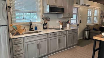 Fridge, microwave, stovetop, coffee/tea maker