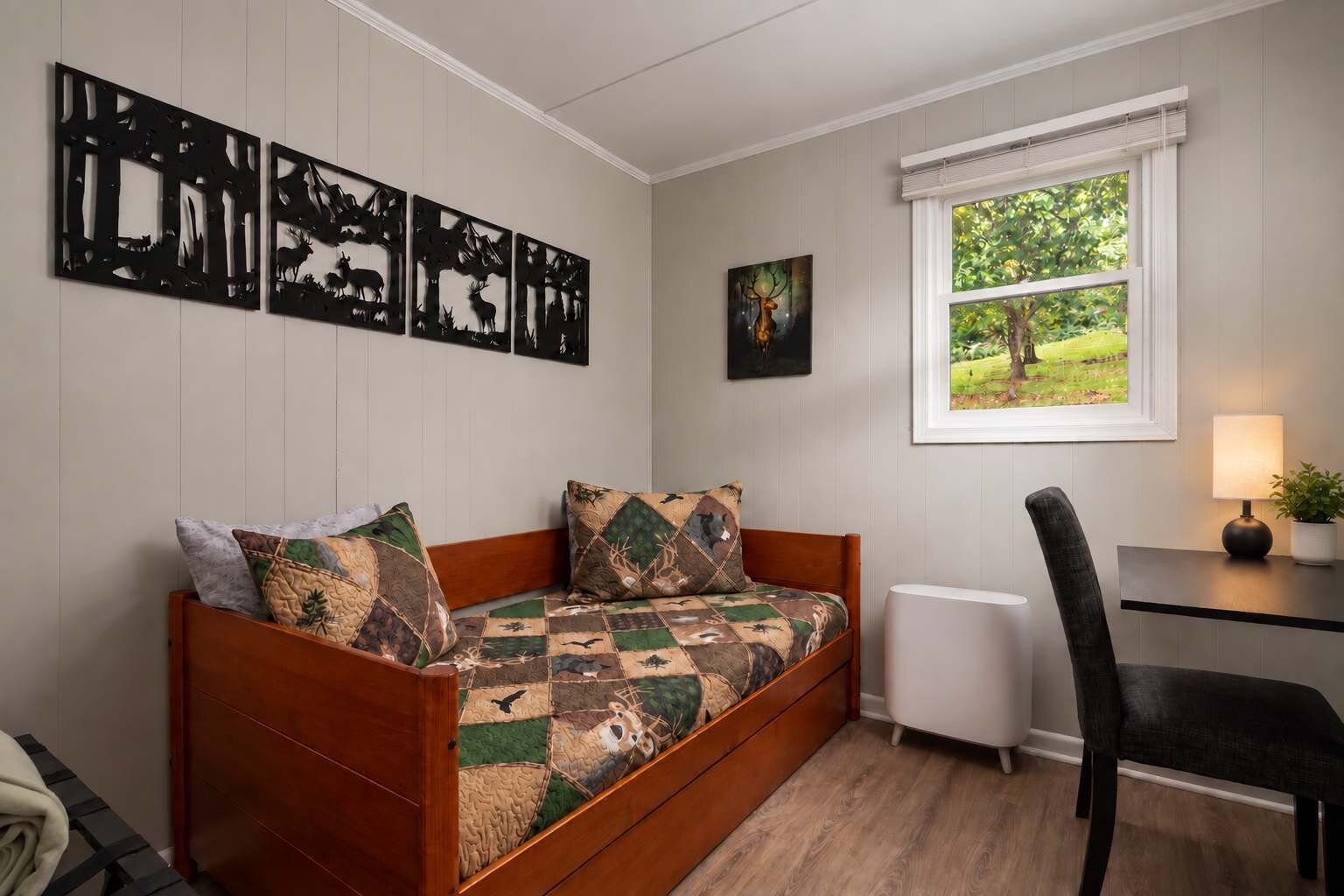 The second bedroom has two twin beds and a small desk by the window for checking email or planning the day.