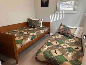 2 bedrooms, blackout curtains, iron/ironing board, travel cot