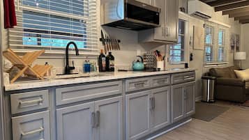 Fridge, microwave, stovetop, coffee/tea maker