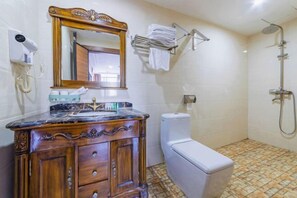 A bathroom with a wooden vanity, a toilet, a shower, and a towel rack. - Marriott Business Hotel (Gaozhou People's Court) (Gaozhou)