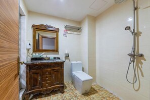 A bathroom with a wooden vanity, a white toilet, and a shower. - Marriott Business Hotel (Gaozhou People's Court) (Gaozhou)