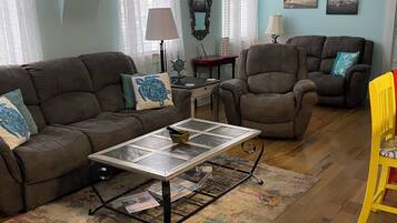 Apartment 1 - Pet Friendly | Living area | 50-inch Smart TV with cable channels, TV, streaming services