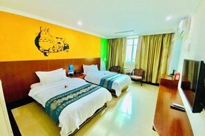 A hotel room with two beds, a television, a desk, and a wall mural. - Yingjia Chain Hotel (Dongguan Xiaobian) (Dongguan)