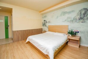 A bedroom with a wooden bed, a nightstand with a plant, and a mural on the wall. - Heng 8 Chain Hotel Shengzhou Sihai Road (Shengzhou)