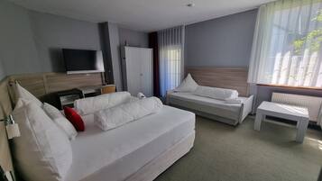 Comfort Quadruple Room | In-room safe, desk, laptop workspace, blackout drapes