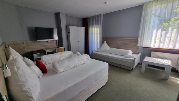 Comfort Quadruple Room | In-room safe, desk, laptop workspace, blackout curtains