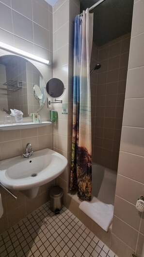 Economy Single Room | Bathroom | Hair dryer, slippers, soap, shampoo