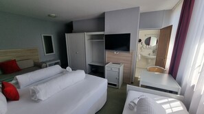 Comfort Quadruple Room | In-room safe, desk, laptop workspace, blackout curtains