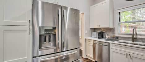 Microwave, stovetop, dishwasher, dining tables