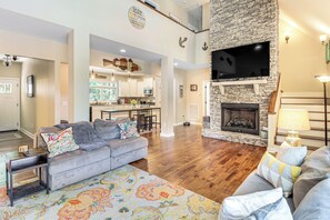 TV, fireplace, books - Modern Tims Ford Lake Home w/ Private Dock & Pool! (Lynchburg)