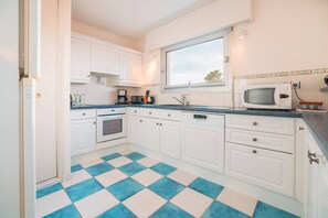 Fridge, microwave, oven, cookware/dishes/utensils