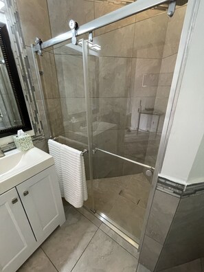 Shower, hair dryer, towels, soap