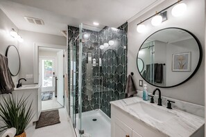 Shower, hair dryer, towels, soap