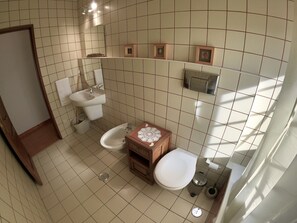 Bathtub, hair dryer, towels