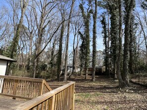Surrounded by a serene forest landscape, this outdoor space offers a peaceful retreat.