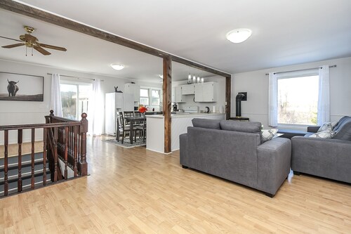 A cozy family retreat surrounded by trees, Nature, comfort and family memories.