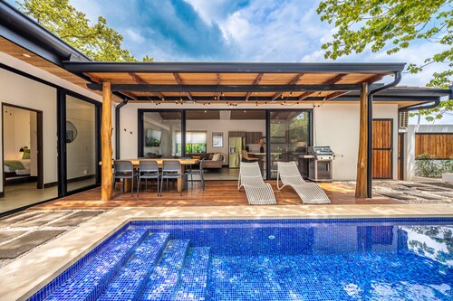 Modern home near the beach & stores with private pool, grill, patio, W/D, & AC