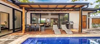 Modern home near the beach & stores with private pool, grill, patio, W/D, & AC