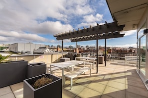 roof top common patio area with harbour views