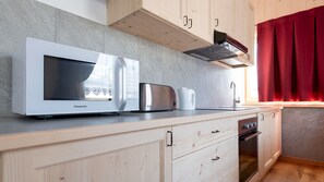 Fridge, microwave, oven, dining tables