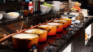 A buffet with various dishes and condiments. - SPEY HOTEL (Guangzhou)