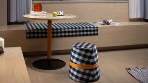 A modern room with a round table, checkered ottoman, and a bench. - SPEY HOTEL (Guangzhou)