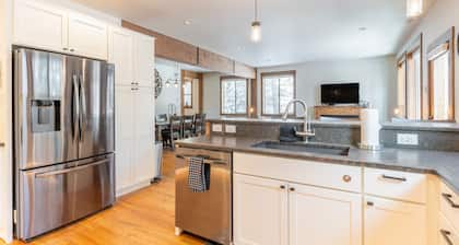 Amiable townhome with fireplace, hot tub, patio, gas grill, deck, & balcony