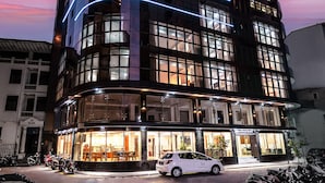 A modern hotel with multiple floors, large windows, and a prominent logo on the top. - Marukab Plaza (Malé)