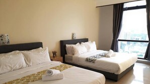 A hotel room with two beds, a large window with a city view, and a clean, modern design. - KL TIMES SQUARE SERVICE RESIDENCIES  (Kuala Lumpur)