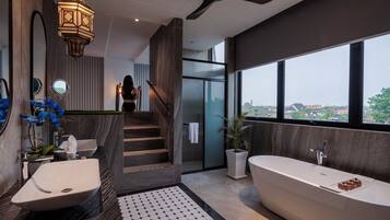 Designer toiletries, hair dryer, slippers, towels