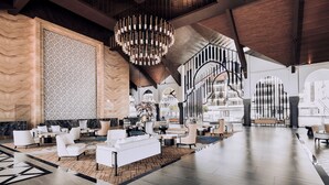 A spacious lobby with a high ceiling, modern furniture, and a large chandelier. - Bertam Resort and Water Park Penang (Kepala Batas)