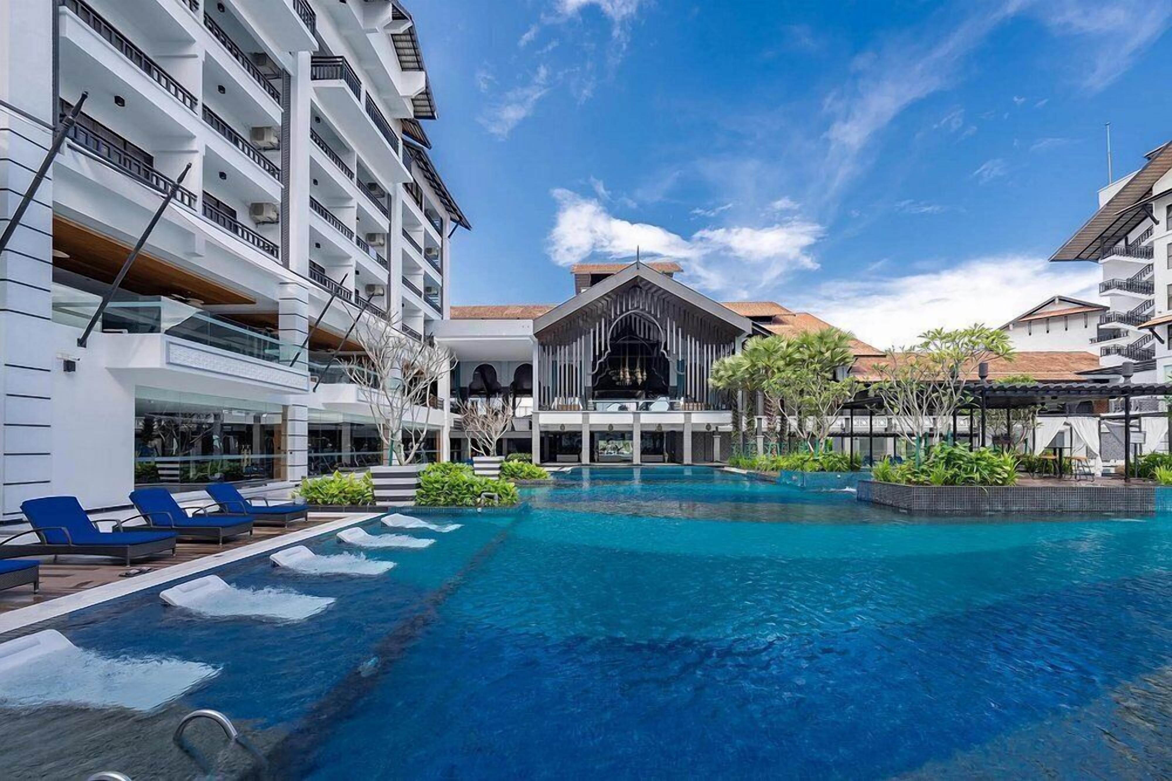 Outdoor pool, open 7:00 AM to 8:00 PM, pool umbrellas, pool loungers