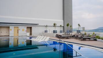 Outdoor pool, open 6:00 AM to 6:00 PM, pool umbrellas, sun loungers