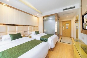 A hotel room with two beds, a wooden headboard, a glass partition, and a wooden floor. - GreenTree Shell Hotel (Yiwu International Business City Changchun Accessories Specialty Street) (Yiwu)