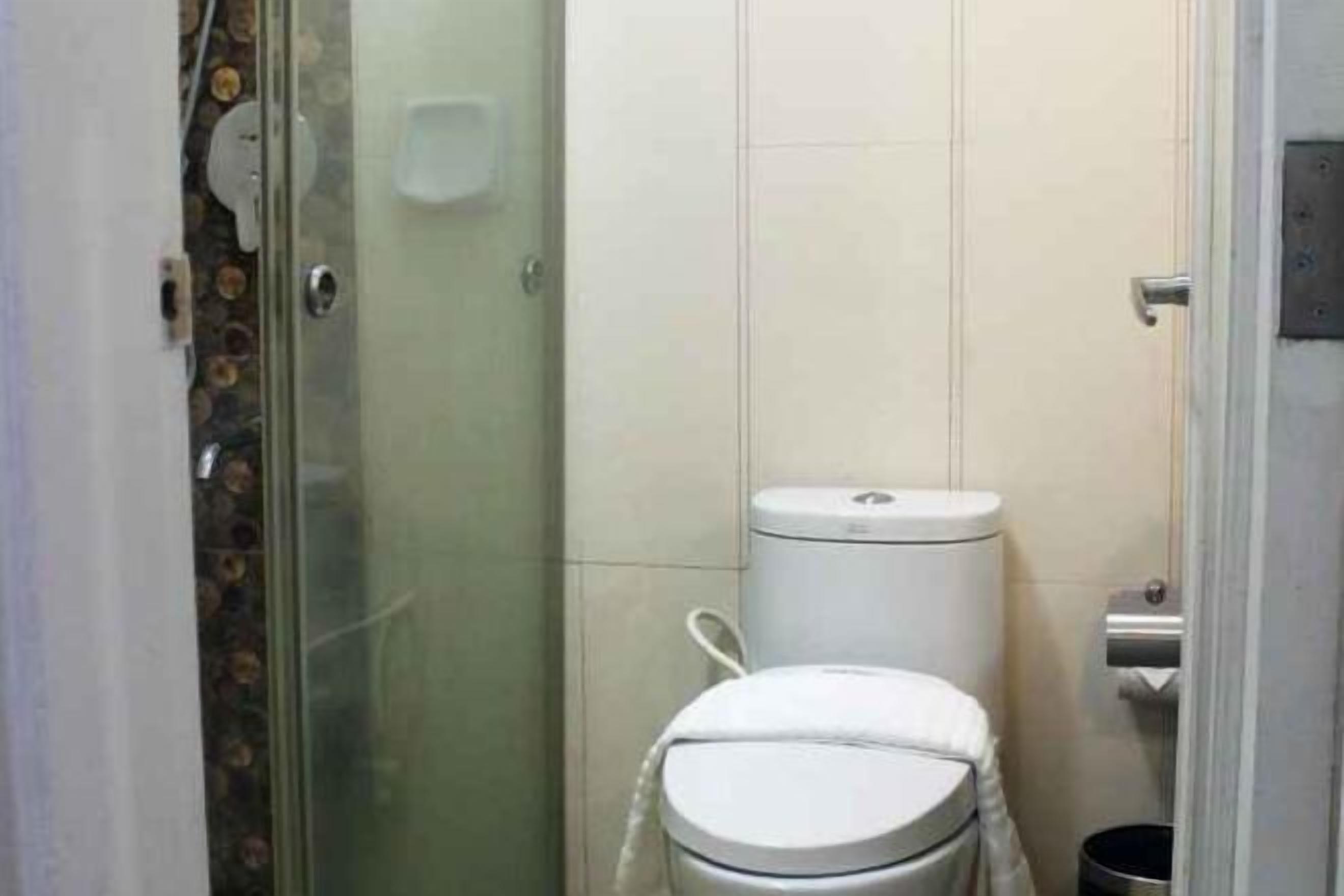 Shower, rainfall showerhead, hair dryer, towels