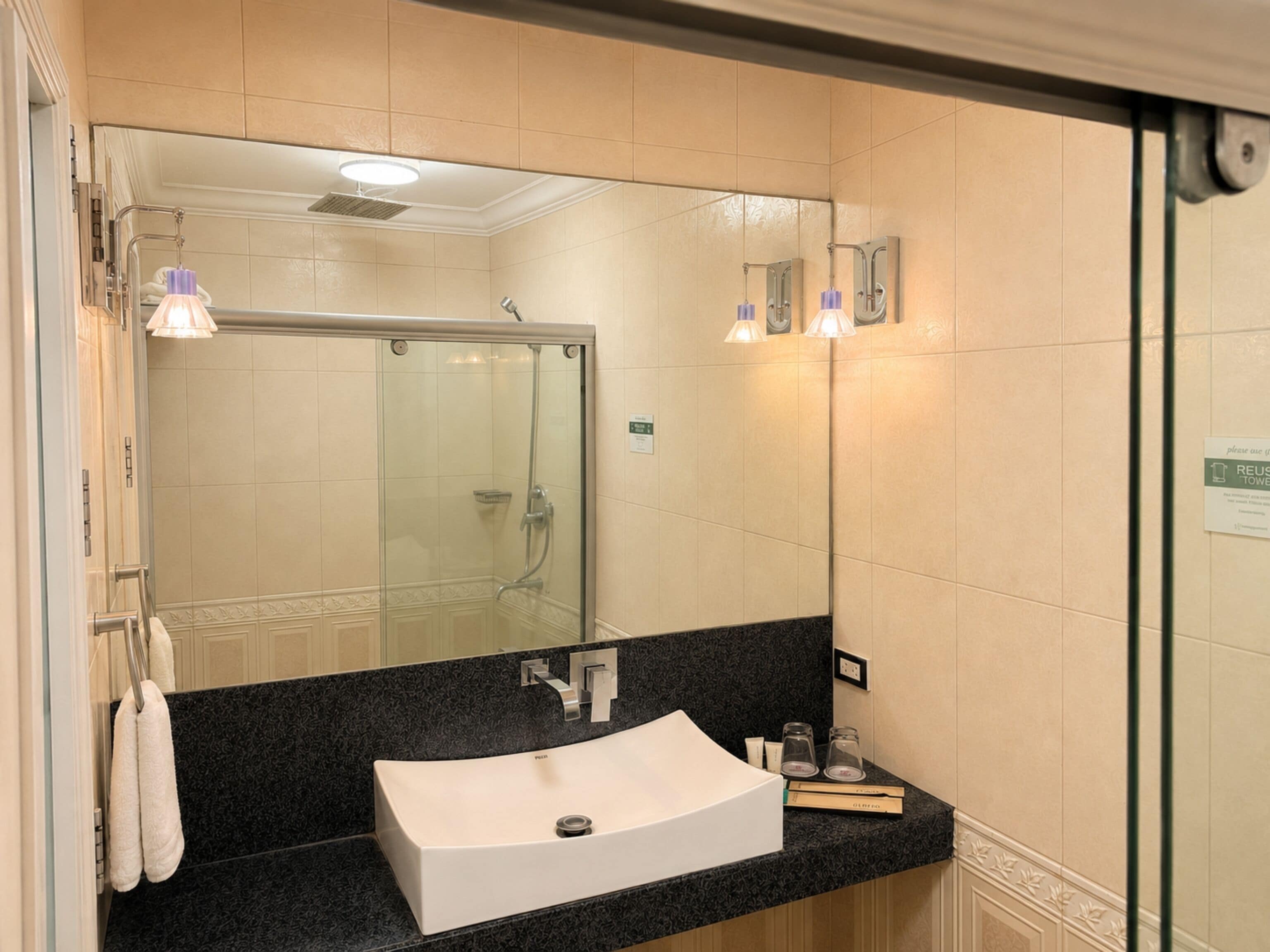 Junior Suite | Bathroom | Shower, rainfall showerhead, hair dryer, towels