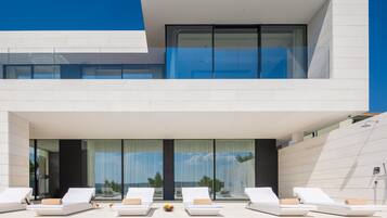 Seasonal outdoor pool, pool umbrellas, pool loungers