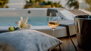 A serene poolside setting with a glass of wine, a flower, and a metal bucket, overlooking a calm body of water and greenery. - Villa Calma I (Starigrad)
