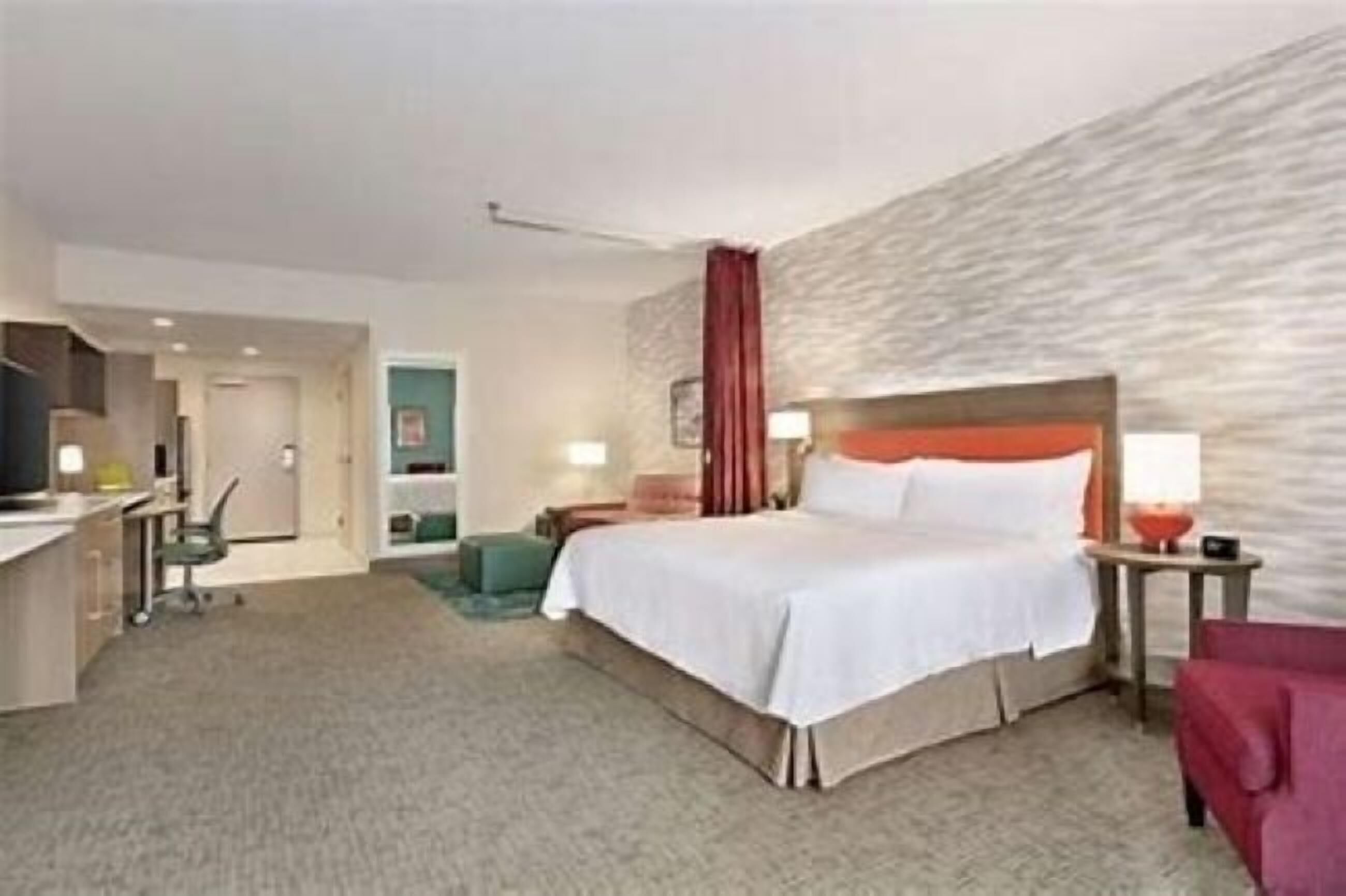 Desk, laptop workspace, iron/ironing board, bed sheets