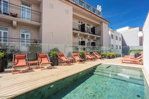 A rooftop pool area with lounge chairs and potted plants. - Arts Hotel Porto, Tapestry Collection By Hilton (Porto)