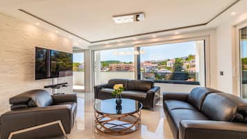 Deluxe Penthouse, Accessible, Sea View | Living area | Flat-screen TV