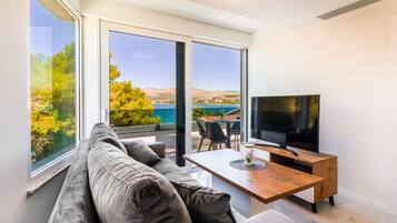 Comfort Apartment, Accessible, Sea View | Living area | Flat-screen TV