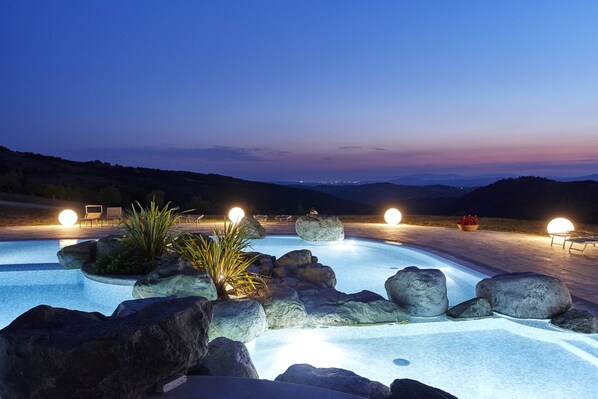 Seasonal outdoor pool, open 8:30 AM to 11:00 PM, pool loungers