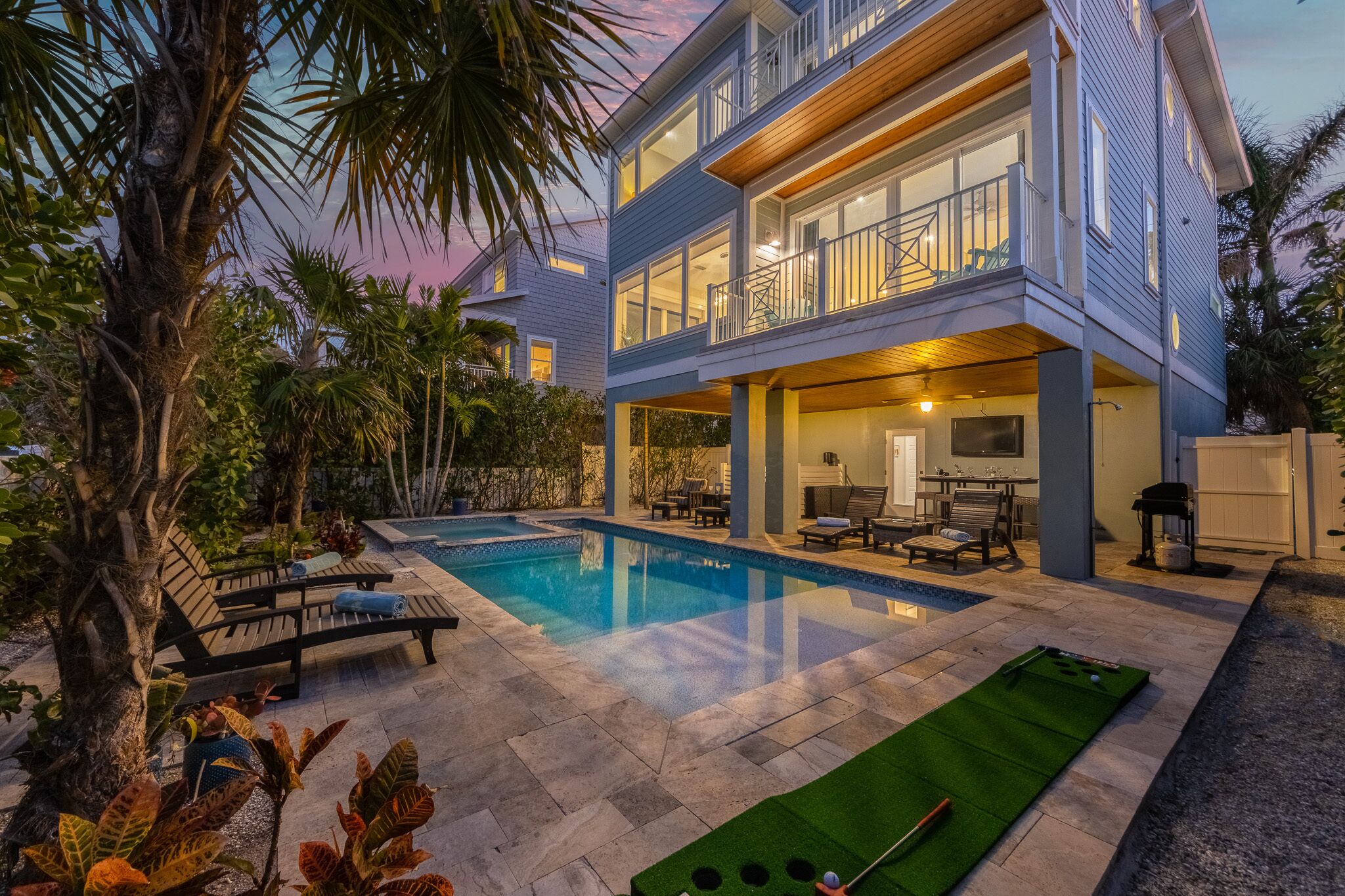 A heated pool, sun loungers