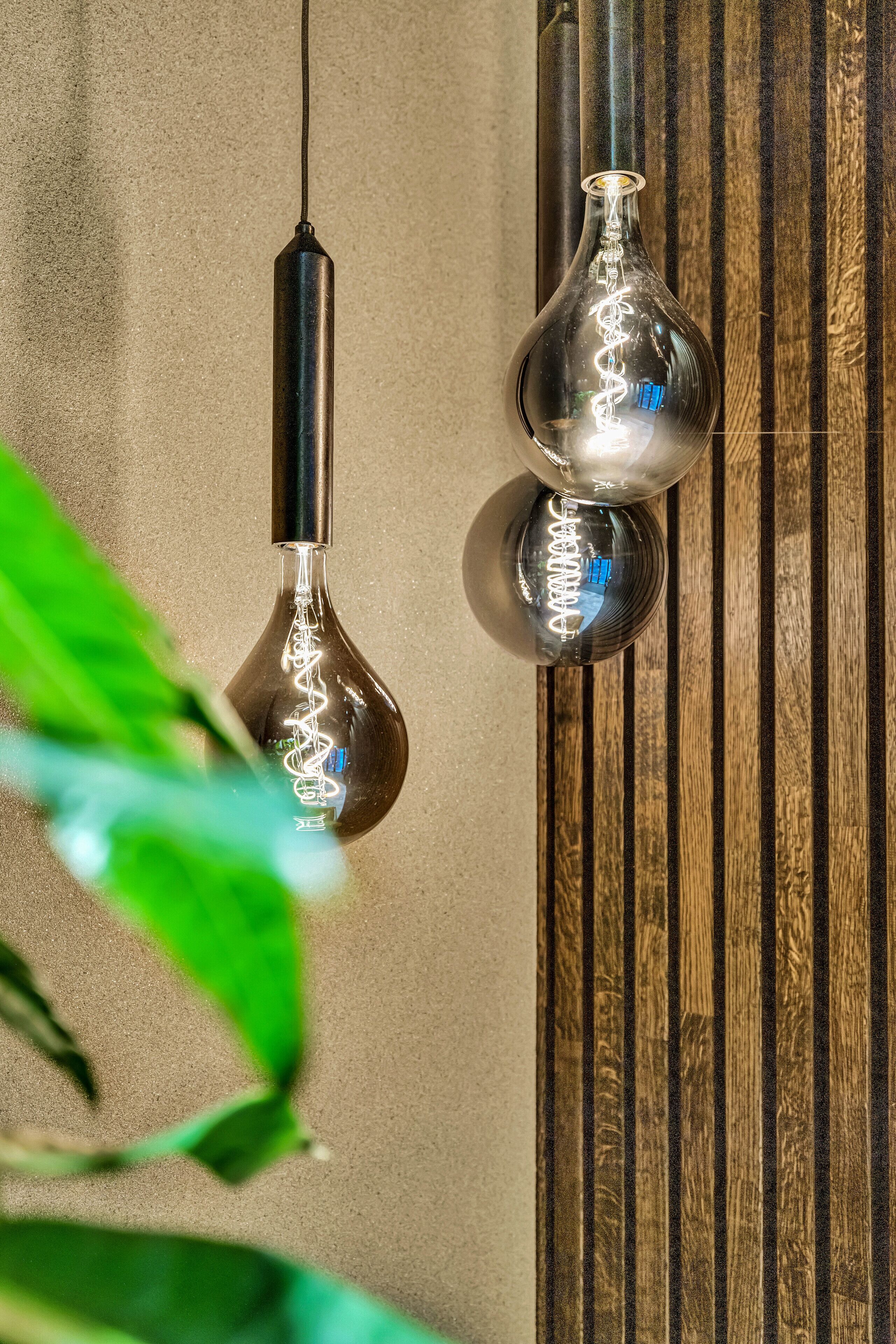Two pendant lights with a metallic finish hanging from the ceiling.