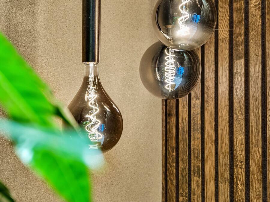 Two pendant lights with a metallic finish hanging from the ceiling.