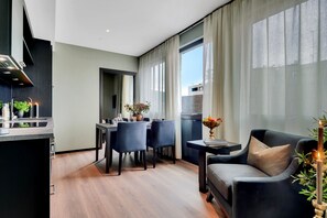 2 Bedroom Study | Living area | 40-inch flat-screen TV with satellite channels, TV, streaming services - Origo Leilighetshotell - Øvre Storgate 5 (Drammen)