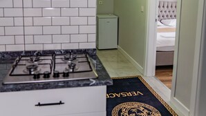Mini-fridge, stovetop, griddle, cookware/dishes/utensils