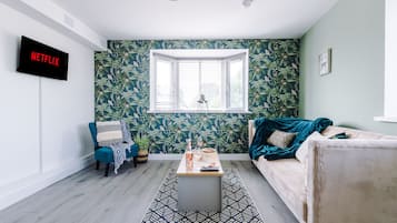 Apartment, 1 King Bed with Sofa bed, Non Smoking | Living area | 43-inch LCD TV with satellite channels, TV